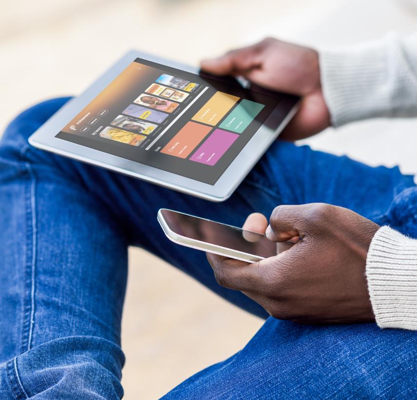 black-mans-hands-holding-smartphone-and-iPad-w-Arc4Independence-on-screen-2