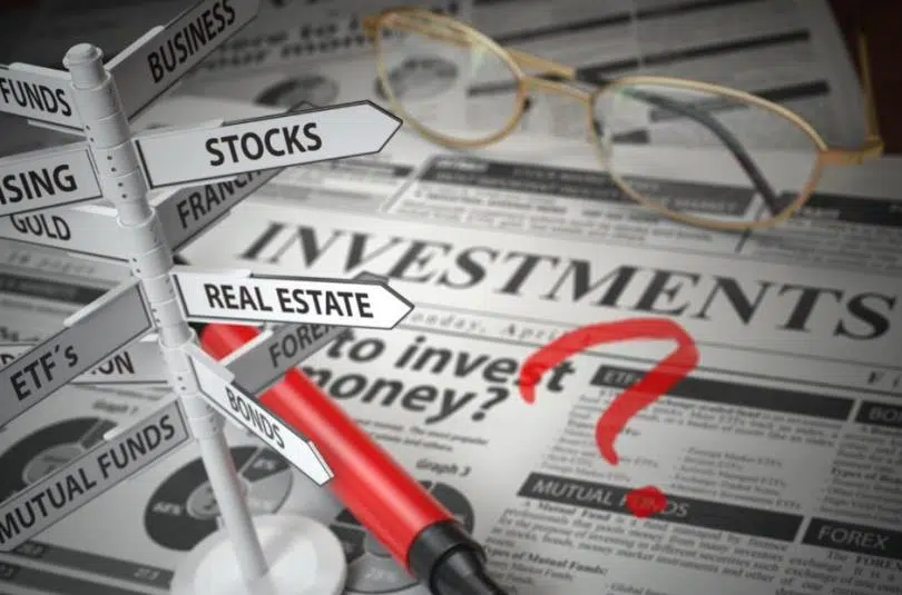 investment-options-sign-and-newspaper