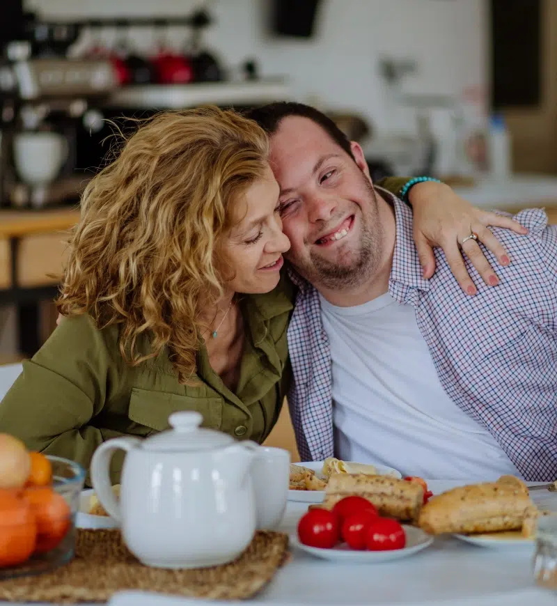 mom-and-adult-son-at-kitchen-table